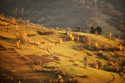 Fall in mountain village. Alpine October scene.