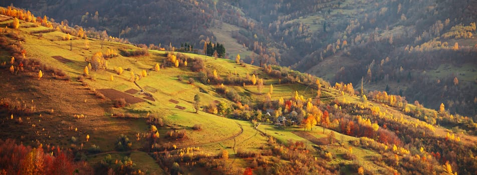 Autumn mountain panorama. October on Carpathian hills. Fall