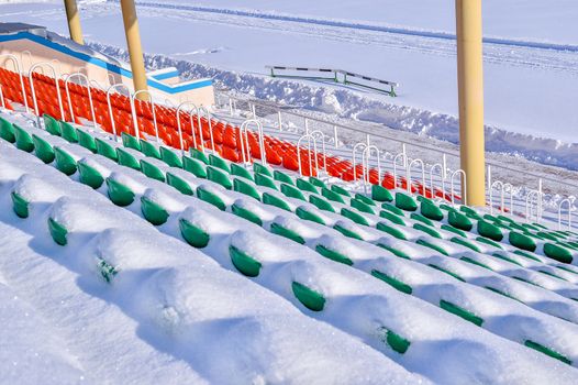 Background chairs at stadium , winter