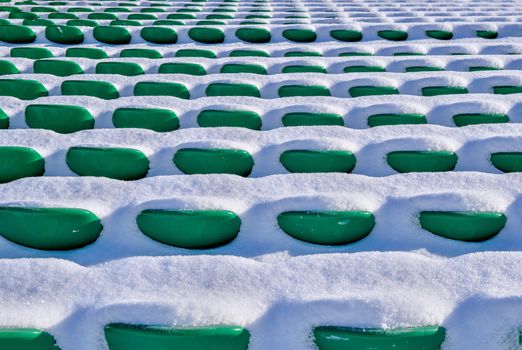 Background chairs at stadium , winter