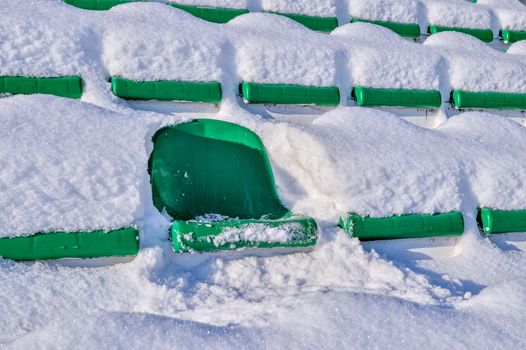 Background chairs at stadium , winter