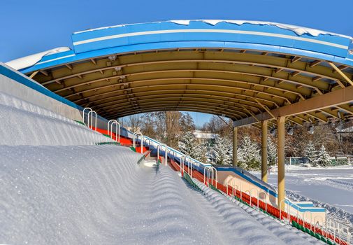 Background chairs at stadium , winter
