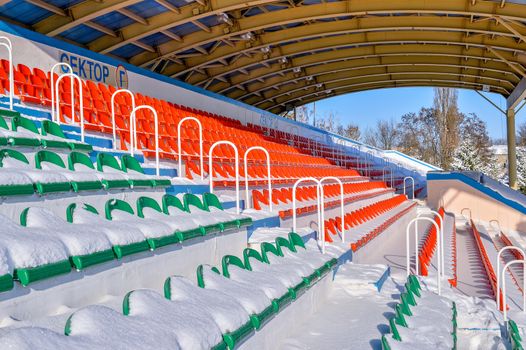 Background chairs at stadium , winter