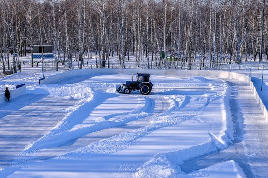 Removing snow from the pitch