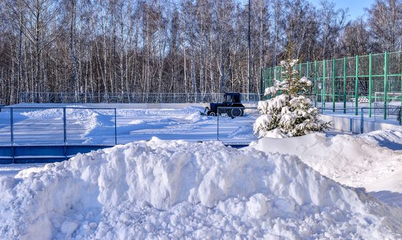 Removing snow from the pitch