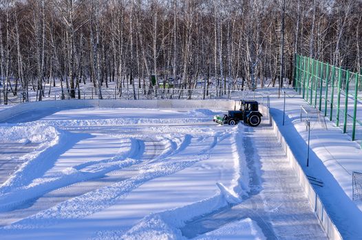 Removing snow from the pitch