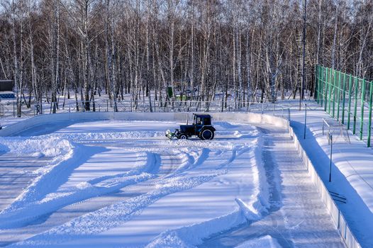 Removing snow from the pitch
