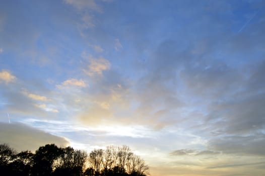 cloudy sky with the colors of the setting sun