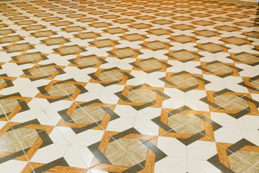 Floor tiled with a patterns like parquet