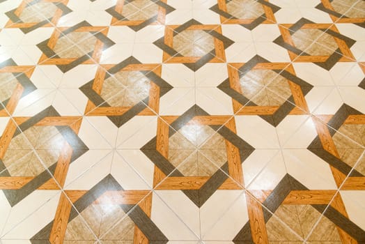 Floor tiled with a patterns like parquet