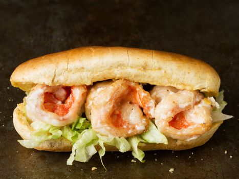 close up of rustic american shrimp po boy sandwich