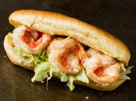 close up of rustic american shrimp po boy sandwich