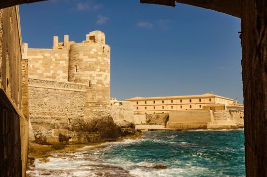 Detail of the wall on the sea of medieval Maniace's Castle in Siracusa