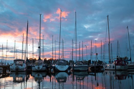 Boats in the harbor from Katwoude in the Netherlands at sunset
