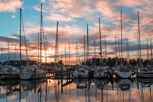 Boats in the harbor from Katwoude in the Netherlands at sunset