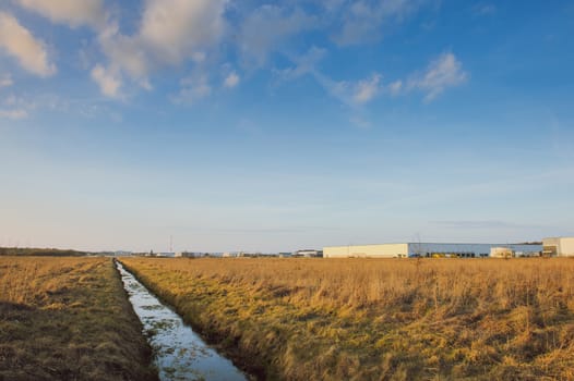 Modern industrial exterior building over blue sky