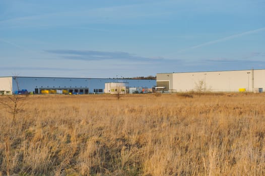 Modern industrial exterior building over blue sky