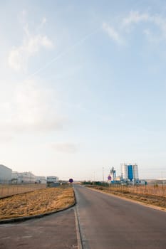 Modern industrial exterior building over blue sky