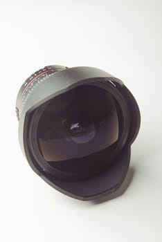 close up of a camera photo lens on white