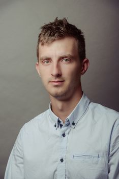 Portrait of a smart serious young man.