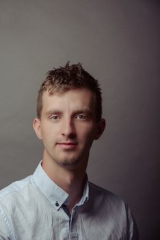 Portrait of a smart serious young man.
