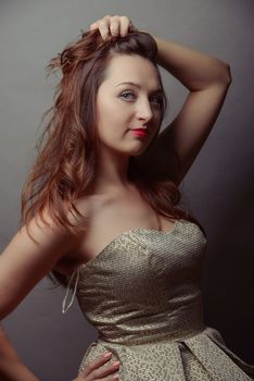 A brunet sexy girl posing in studio