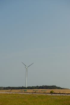 wind trubine at sunny day with blue sky