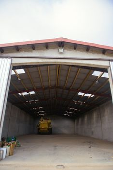 combine harvester standing ready for harvest in a warehouse