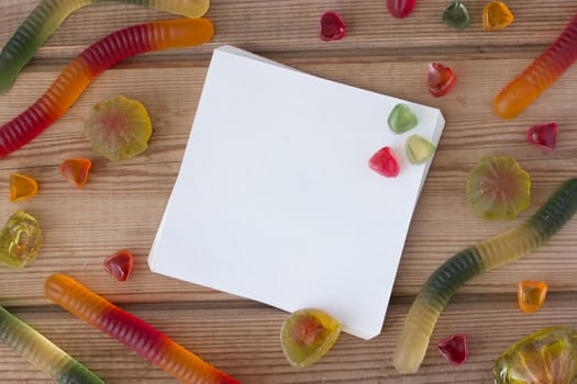 colorful marmalade on wooden background, mock up