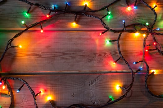 Christmas tree garland on wooden table mock up