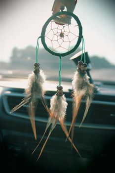 green dream catcher against the sun, toned