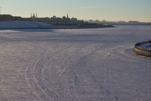 car tracks on the snow, empty snow field