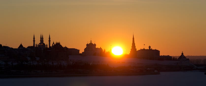 golden and orange winter sunset, kazan kremlin silhouette  