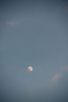 full moon background at the dusk on cloudy sky