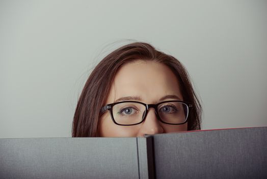 Business woman holding a wide open book