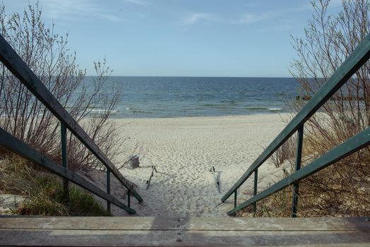 walkpath to the beach made with wood and reeds.