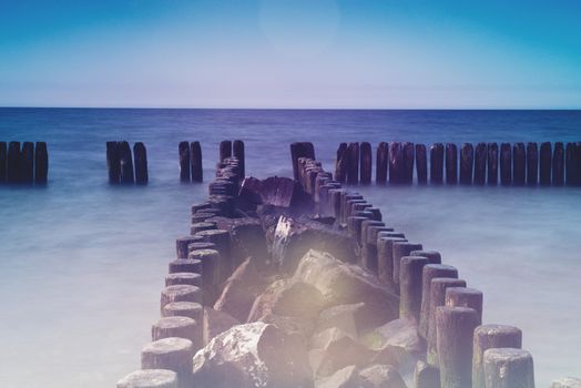 Breakwaters in the Baltic Sea at sunset