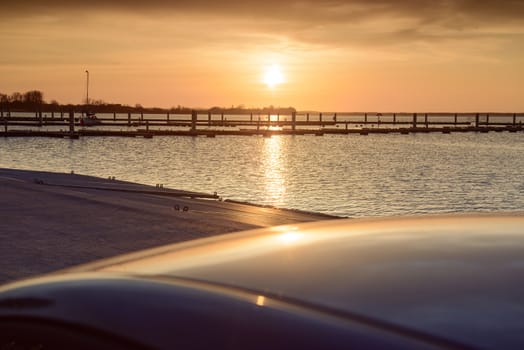 Yacht port over beautiful orange sunset in summer time
