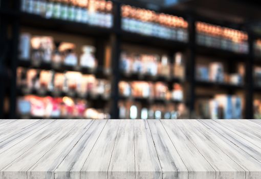 Luxury white wooden table top with blurred coffee shop background. product display template