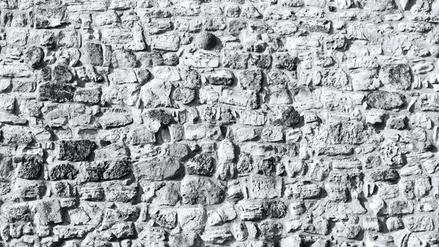 Stone wall background in black and white photography