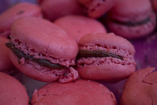 Many colored macarons exposed in a confectionery