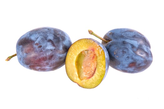 Blue plums isolated on a white background