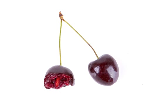 Dark red cherry isolated on a white background