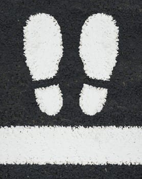 Symbol Of Two Feet Painted As A Road Marking