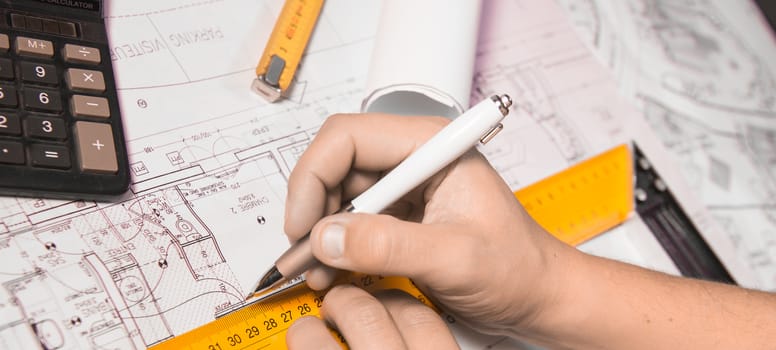 business, architecture, building, construction and people concept ,close up of architect hands with plan