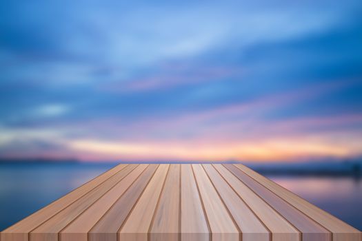 Empty table top of wooden table with sunset background. For product display