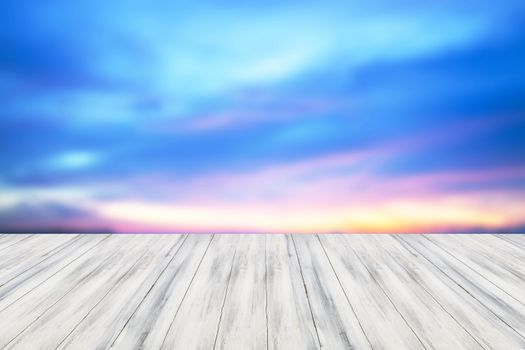 Empty white table top wooden with sunset background. For product display