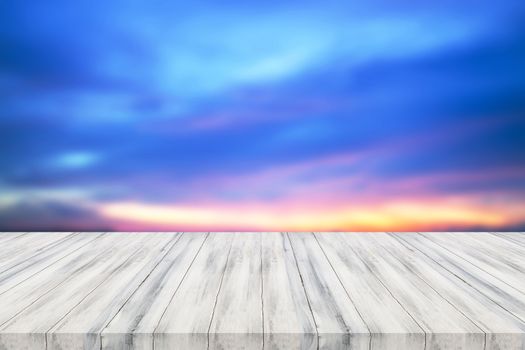 Empty white wooden table top with sunset background. For product display