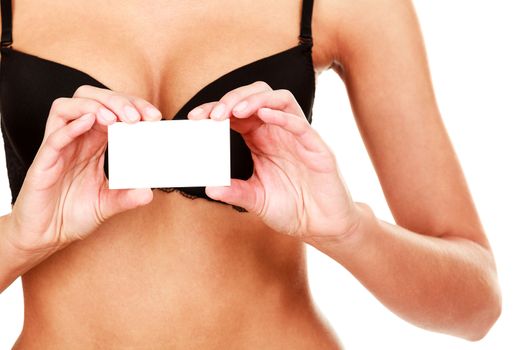 Woman in black bra shows empty card, isolated on white background