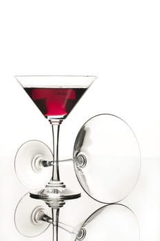 Wineglasses on glass reflecting background